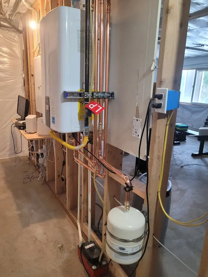 Licensed plumber repairing a kitchen sink in Hampden